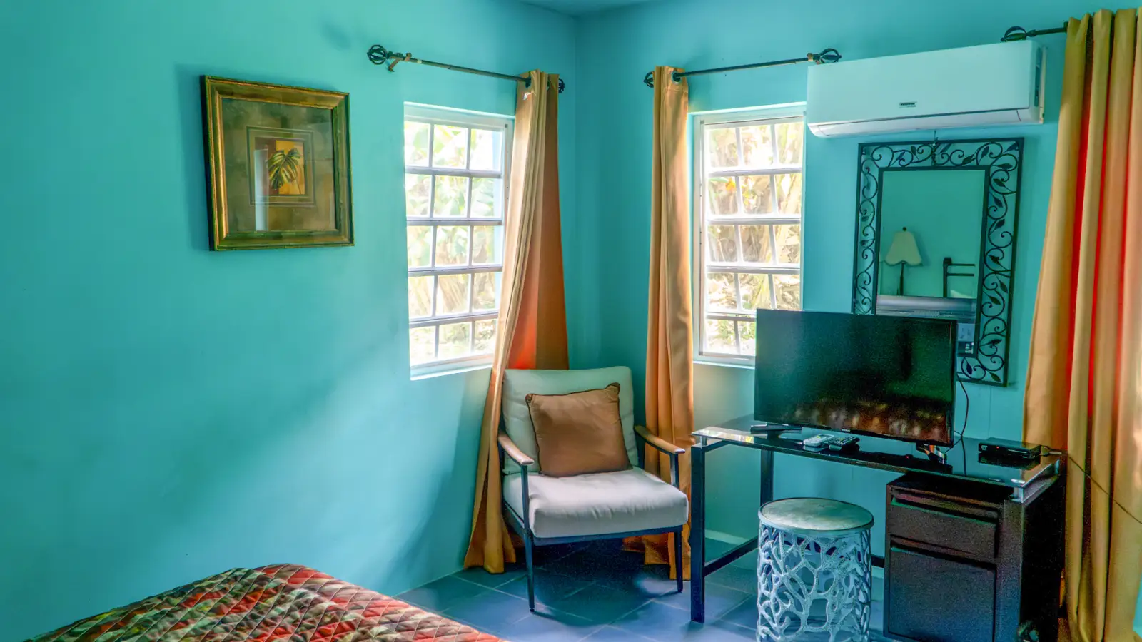 Bedroom with desk and workspace for remote work during a long stay at LambLion, Antigua
