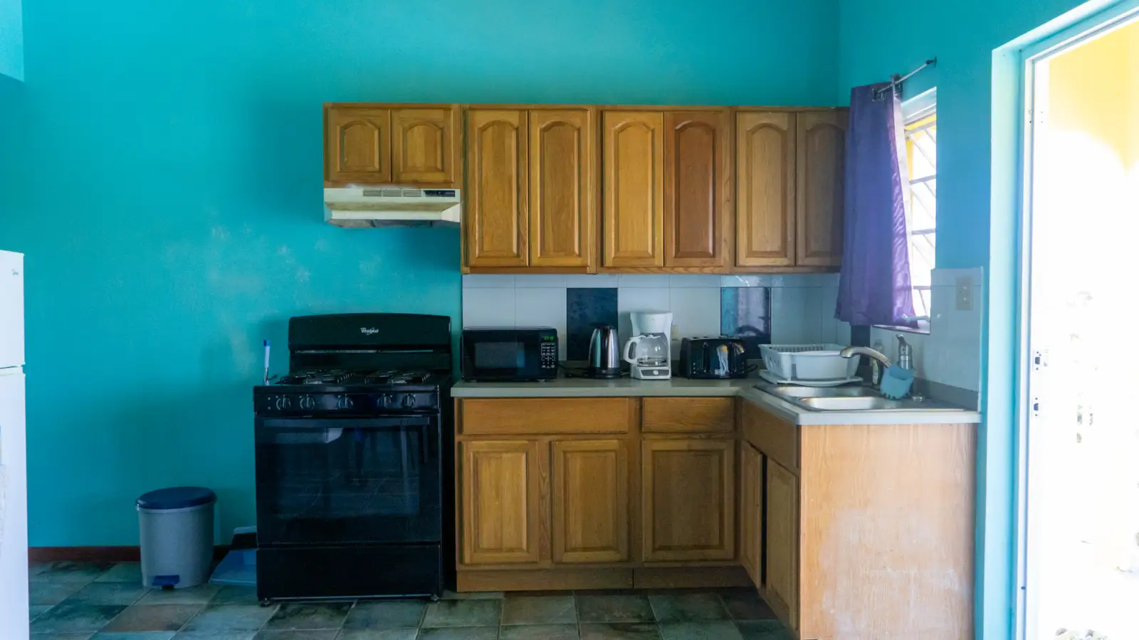 Kitchen with gas cooker in a two bedroom self catering apartment at LambLion, Antigua