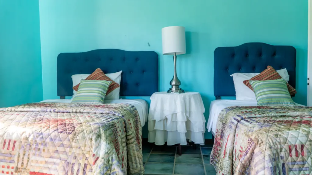 Twin beds in a two bedroom apartment at LambLion, a quiet base for Antigua Sailing Week crews