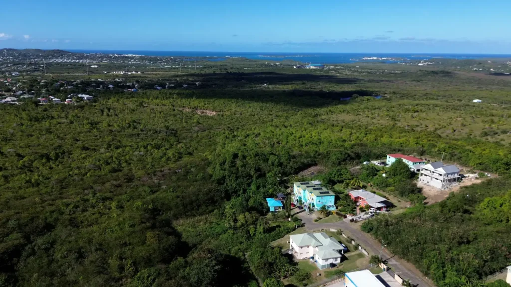 Aerial view over central Antigua from LambLion Apartments towards the sea