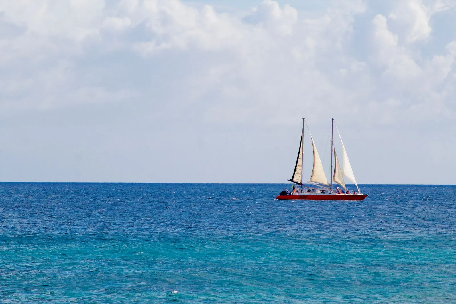 Sailboat on blue Caribbean water during the winter sailing season