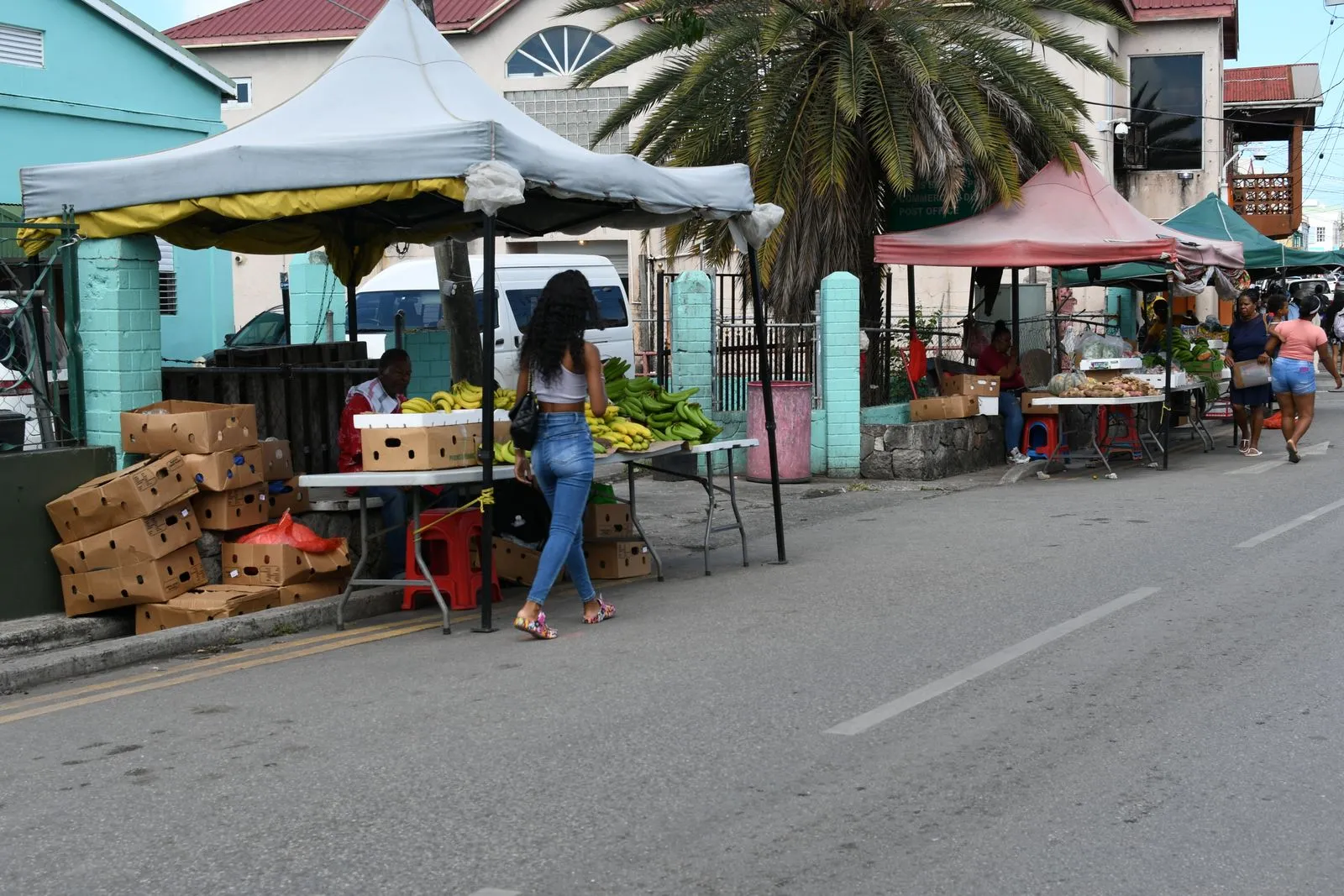 Shoppers buying fresh produce at the street market in St John's, Antigua