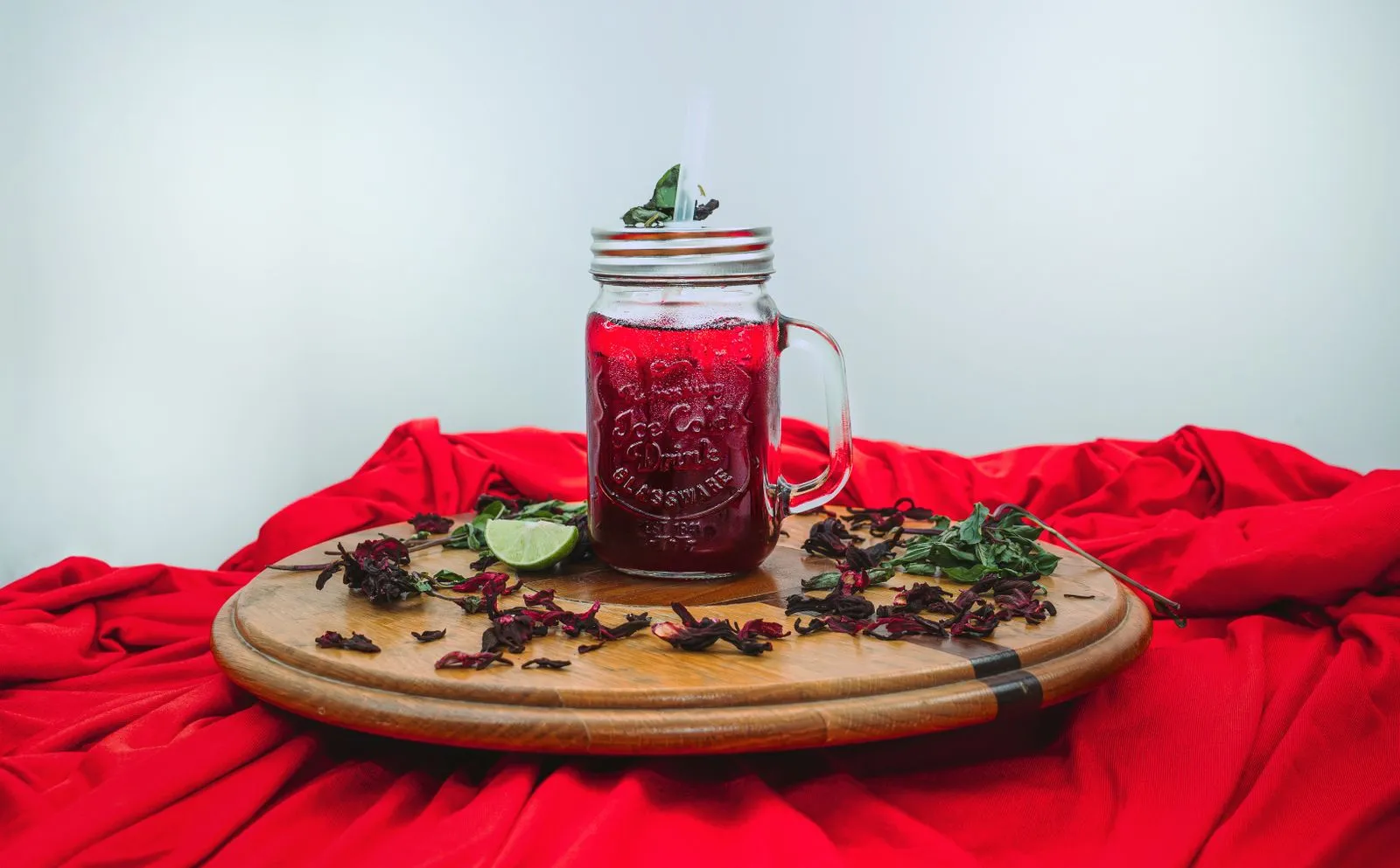 A jar of chilled sorrel drink made from hibiscus with lime, the classic Christmas drink in Antigua