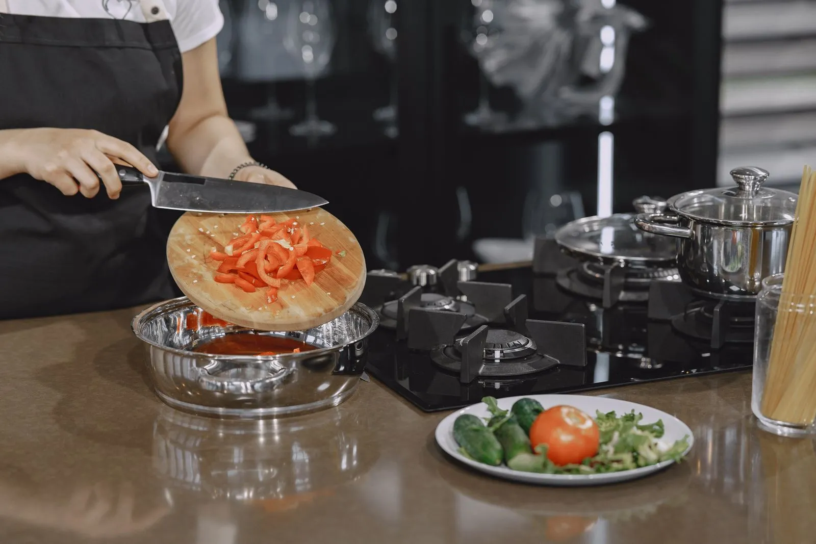 Fresh vegetables being sliced for a home cooked meal