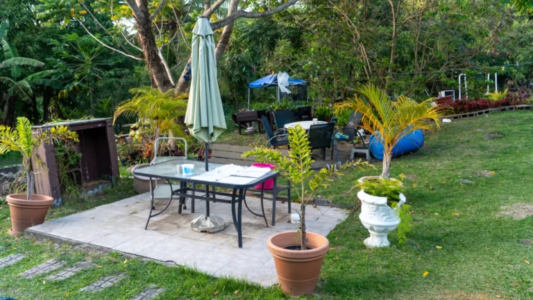 Garden table under an umbrella at LambLion, a quiet place for working remotely from Antigua