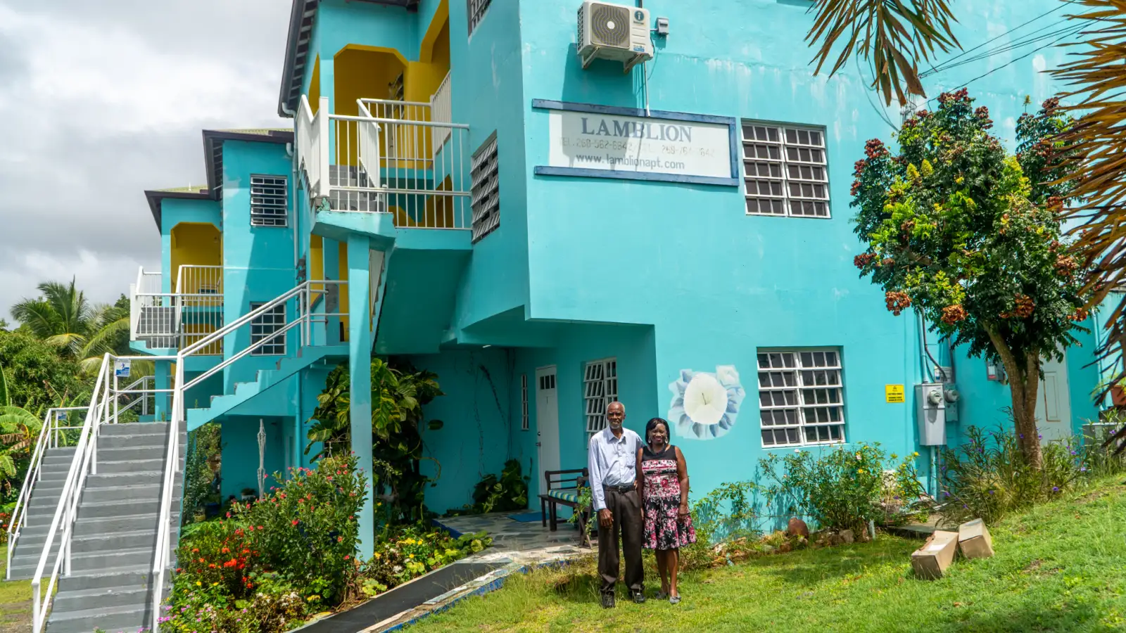 Lionel and Lorilyn Walker outside LambLion Apartments in central Antigua